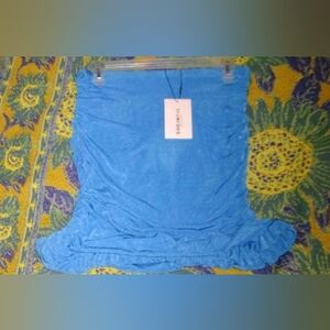 Bright blue mini skirt with ruffles on the bottom soft,scrunchy fabric,